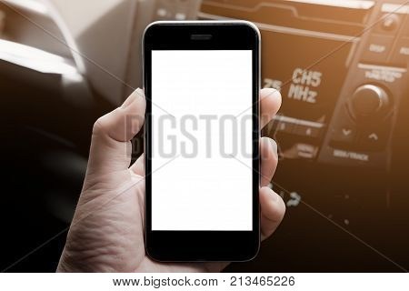 A man hand holding smart phone in car. mobile with blank screen and can be add your texts or others.