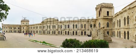 A Tour Group Of Teenagers In The Courtyard Of The Museum Mikhaylovskaya Coastal Battery — A Fortific