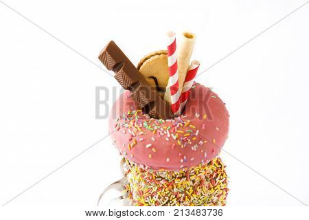 Extreme milkshake or freak shake isolated on white background