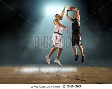 Caucassian Basketball Player in dynamic action with ball in a professional sport game