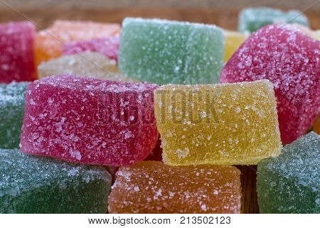 Tasty marmalade candies with different colors close up