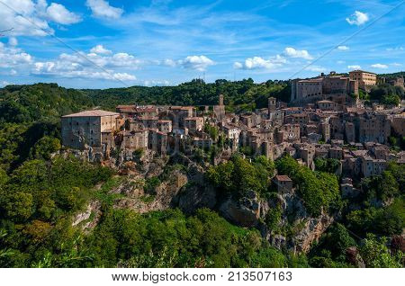 Classic panoramic view of the ancient town of Sorano an ancient medieval hill town hanging from a tuff stone over the Lente River. province of Grosseto southern Tuscany Italy