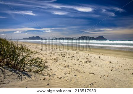 White Sandy Beach With Beautiful Blue Sky At Waipu,new Zealand