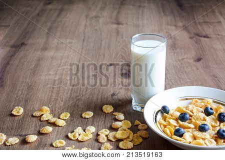 Cereal and fruit for Breakfast on the table.