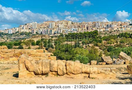 Fallen statue of Atlas at the Temple of Olympian Zeus in the Valley of Temples near Agrigento, Sicily - Italy