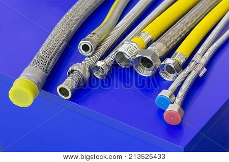 Variety of gas connecting hoses on the counter. Industry
