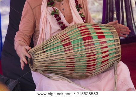 Hindu with a drum performs a cult rite. Religion