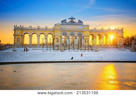 VIENNA - DECEMBER 13 2012: Gloriette in Schonbrunn Palace, Vienna, Austria illuminated by sunset on December 13, 2012. Built in 1775, it was used as a dining hall for emperor Franz Joseph I.