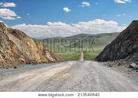 View On Road, Mountains And Sky With Clouds From  The Obotyn-daba Mountain Pass