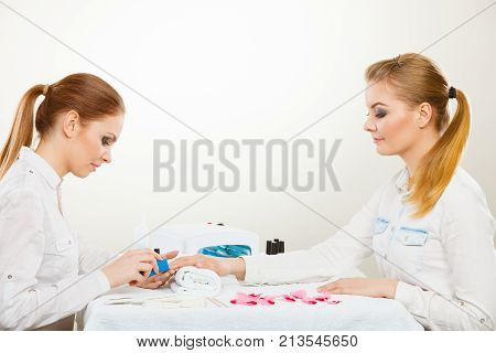 Beautician With Client At Beauty Salon.