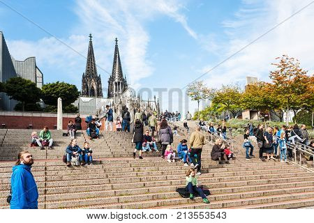 Tourists On Steps In Cologne City In September