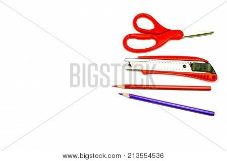Stationary with scissor,cutter,pencil in red tone isolated on white for copy space