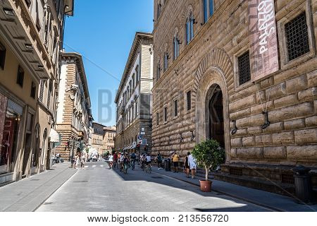 Florence, Italy - August 23, 2016: Palazzo Strozzi in Florence a sunny day of summer. It is a renaissance palace and an example of civil architecture with its rusticated stone.