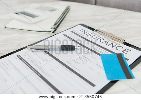 personal insurance using credit card paying concept - people through online e-commerce system buying assurance scheme at home.
