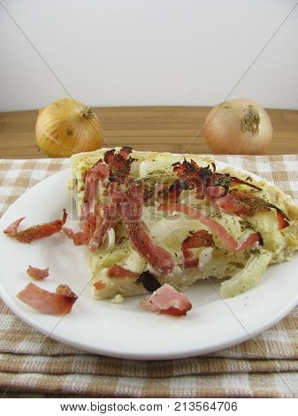 Fresh baked tarte flambee on a plate
