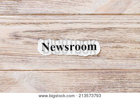 Newsroom of the word on paper. concept. Words of Newsroom on a wooden background.