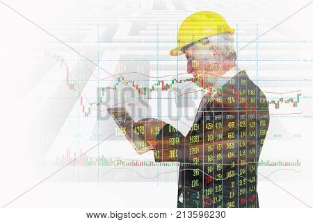 Double Exposure of Businessman use Wireless Digital Tablet Application connect with Candlestick and Bar graph Show Stock Market price Data and Labyrinth or Maze Background as Business Technology App Concept.