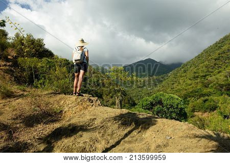Tourist no the trail for the highest peak on Cuba Pico Turquino being in a mountain range Sierra Maestra on Cuba