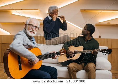 Senior Friends Playing Music