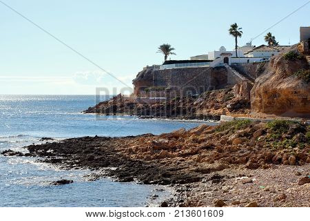 Rocky coastline of Cabo Roig. Province of Alicante. Costa Blanca. Spain