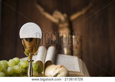 Eucharist symbol of bread and wine, chalice and host, First communion background