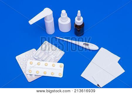Medications, Pills And A Thermometer On A Bright Background