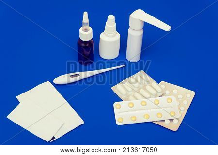 Medications, Pills And A Thermometer On A Bright Background
