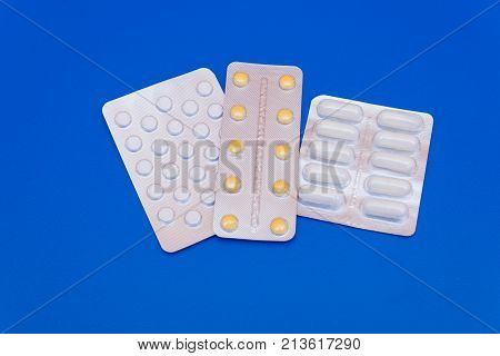 Medications, Pills And A Thermometer On A Bright Background