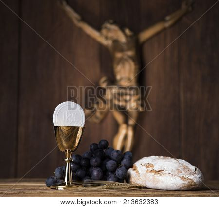 Eucharist symbol of bread and wine, chalice and host, First communion background