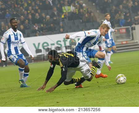SOLNA SWEDEN - OCT 30 2017: Soccer player Chinedu Obasi (AIK) getting folded. October 30 2017SolnaSweden