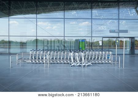 ZAGREB AIRPORT - 24 APRIL 2017: Trolley stand at the entrance of the departures terminal.