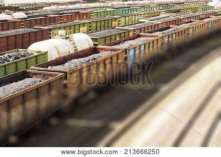 rail cars loaded with coal, a train transports coal. Many different rail cars