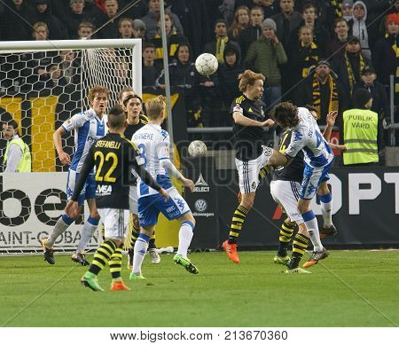 SOLNA SWEDEN - OCT 30 2017: Soccer player in the game AIK and IFK Gothenburg fighting in front of the goal the goal. October 30 2017SolnaSweden