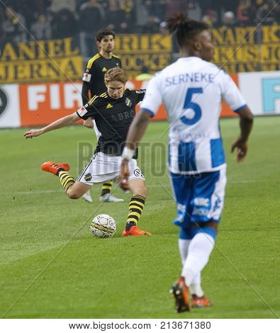 SOLNA SWEDEN - OCT 30 2017: Soccer player from the team AIK shooting the ball. October 30 2017SolnaSweden