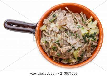 a  crock pot  of valtellinese pizzoccheri on white