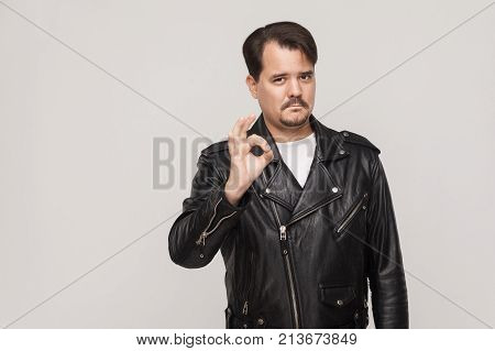 Rocker Man Showing Okay Sign And Looking At Camera.