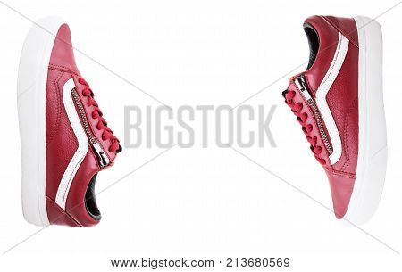 Fashion shoes with shoestring. Red sneaker and shoelace isolated on white background