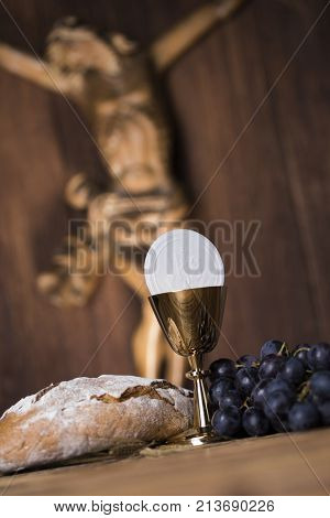 Eucharist symbol of bread and wine, chalice and host, First communion background