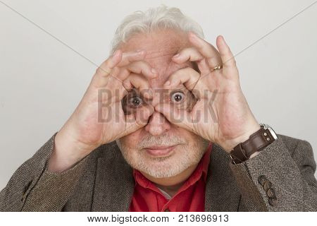 Eldery person focussing the future - on bright background