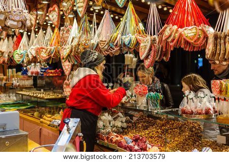 BERLIN - NOVEMBER 12 2017: Tradition Christmas Market (Weihnachtsmarkt) on Potsdamer Platz. Sale of various gingerbreads candies and sweets.