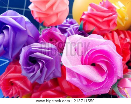 Rose fake flower and Floral backgroundrose flowers made of fabric. The fabric flowers bouquet. Colorful of decoration artificial flower.