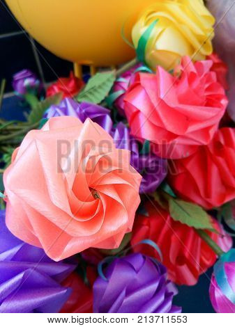 Rose fake flower and Floral backgroundrose flowers made of fabric. The fabric flowers bouquet. Colorful of decoration artificial flower.