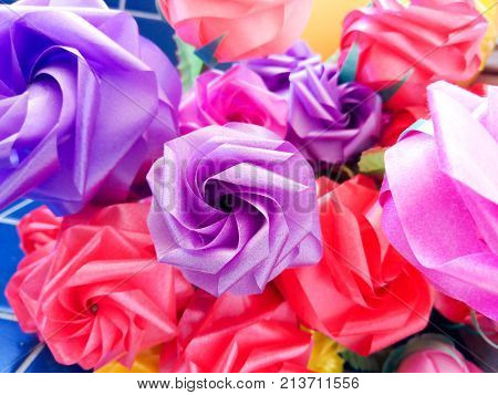 Rose fake flower and Floral backgroundrose flowers made of fabric. The fabric flowers bouquet. Colorful of decoration artificial flower.