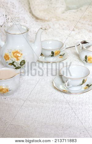 Antique Tea-set With Sugar And Milk On White Table Close-up