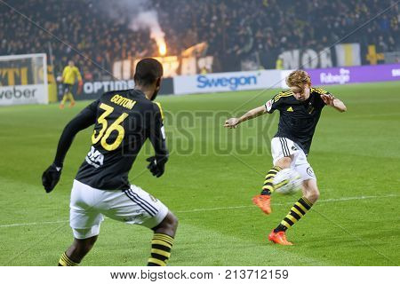 SOLNA SWEDEN - OCT 30 2017: Soccer player from the team AIK shooting the ball. October 30 2017SolnaSweden
