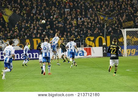 SOLNA SWEDEN - OCT 30 2017: Soccer player in the game AIK and IFK Gothenburg nick the ball. October 30 2017SolnaSweden