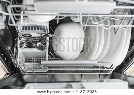 clean dishes in the dishwasher. Kitchen appliances
