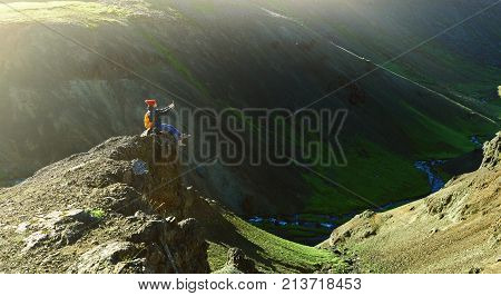 back view of woman traveler on a walk in the Valley of the river of Hveragerdi Iceland. Hiking Tour of Reykjadalur Hot Springs