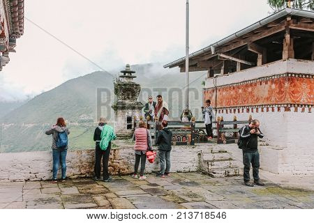 Trongsa, Bhutan - September 13, 2016: Tourist Group Taking Photos In The Courtyard Of Trongsa Dzong,