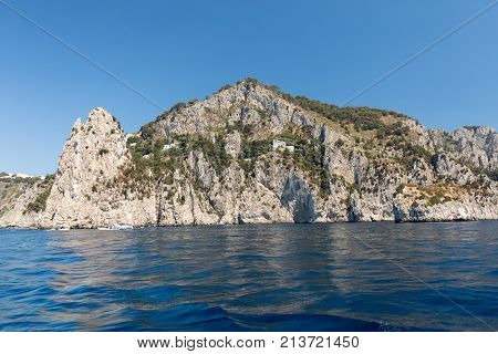 View from the boat on the cliff coast of Capri Island Italy